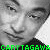 Black-and-white pixelated portrait of a person with short hair, wearing a dark shirt, with green text at the bottom.