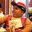A pixelated image of a child in red suspenders and cap with orange background text reading 'christina i love you' and other phrases.