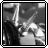 Black-and-white animated icon showing a figure with long dark hair holding a spiked object, with text reading 'spikes' in the upper right corner.
