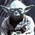 Pixelated static image of a small green alien character with large ears and white hair, wearing dark robes against a dark background.