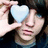 A person holds a light blue heart-shaped object over their eye, with pink text reading 'emo guys are HOTT!' on black background.