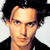 Animated contact sheet showing two frames of a pixelated Johnny Depp character with dark hair and black jacket against white background, alongside CoolBuddy.com logo on teal background.