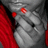 A pixelated close-up of a character's face with red accents on the left side, featuring two red glowing eyes and a dark mouth area against a gray background.