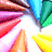Pixelated colorful pencil tips radiate from a central white starburst, with text reading 'color my world' in black block letters on the right side.
