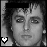 Black-and-white pixelated icon featuring a person's face with visible hair, eyes, nose, and mouth against a dark background, including a small white heart symbol in the bottom-left corner.