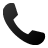 Black wireframe phone receiver icon on light gray background, curved shape with rounded ends, pixelated rendering.