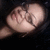 A person with dark hair and glasses appears in a of four , the rightmost showing only empty space