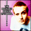 Pixelated image of a person in light blue shirt against pink background with text "THE BRUISES PROVE IT'S REAL" on left side.