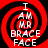 Red and black spiral background with white text reading "I AM UR BRACE FACE" arranged in a circular pattern.