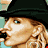 A 48x48 pixel animated contact sheet showing three sampled frames of a celebrity character with blonde curls, black beret, and heart-shaped earrings in various poses against a gray background.