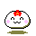 Four pixel-art frames of a round white character with pink cheeks, red flower on head, and green or gray base, showing different facial expressions in an animation sequence.