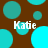 Brown background with scattered cyan circles; four instances of the text 'Katie' in white pixelated font; some circles partially overlap the text.
