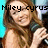A pixelated image of a woman with long brown hair holding a microphone, with overlaid text reading "Miley cyrusmah monte".