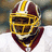Pixelated image of a football player in maroon and gold helmet with yellow face mask, white jersey, red collar, against blurred background.