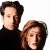 A 50x50 pixel animated contact sheet showing two frames of a buddy icon featuring two people on the left and green text "Original Icons .com" on the right against a dark background.