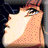 Pixelated close-up of a character's face with light skin, dark eyes, and reddish-brown hair against a dark background.