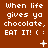 Brown background with white pixelated text reading 'When life gives ya chocolate, EAT IT! ( :' followed by a changing symbol in the lower-right corner.