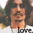 A pixelated image of a person with long dark hair and sunglasses, wearing a white shirt, with the word 'love.' in black text below.