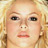 Static 48x48 pixel icon showing a close-up of a person's face with blonde hair, blue eyes, and light skin tone against a blurred background.