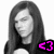 A grayscale image of a person with long hair, wearing a dark top, with a bright pink '<3' symbol in the lower center.