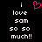 Pixelated text reads "i love sam so so much!!" with a pink heart symbol replacing the 'o' in 'love', displayed on black background.