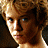 Pixelated close-up of a person's face with brown hair and blue eyes, rendered in low-resolution 48x48 pixels using a limited color palette.