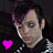 Pixelated image of a person with dark hair and blue eyes next to Jack Skellington, both flanked by pink hearts.
