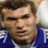 Static 48x48 pixel buddy icon showing a close-up of a person's face with brown hair and blue clothing, rendered in low-resolution pixel art style.