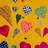 Yellow background with scattered pixelated shapes including hearts, leaves, and abstract forms in red, green, blue, orange hues.
