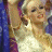 Pixelated image of a woman in a white dress with blonde hair, showing two sequential poses against a blue background.