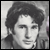 Black-and-white pixelated static image of a person's face with curly hair, visible in a 50x50 icon frame.