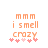 Pixelated orange text 'mmm i smell crazy' above five pink hearts on white background, with subtle animation changes in heart positions.