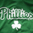 Green pixelated background with white stylized text and a white four-leaf clover symbol below the text.