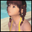 Pixelated image of a person with brown hair in braids wearing yellow straps against a beach background, next to black with white text
