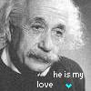 Black-and-white pixelated portrait of a person with tousled hair, wearing a dark shirt with a light collar, with overlaid text reading 'he is my love' and a small multicolored pixel cluster.