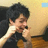 A pixelated image shows a person with dark hair holding hands near their face, next to red text on black background reading "he just made flossing HOT!!".