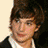 A 4-frame contact sheet of a young man with brown hair in various poses and backgrounds, displayed as an animated AIM buddy icon.