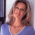 A 50x50 pixel animated contact sheet showing two frames of a woman with shoulder-length brown hair in a blue top on the left and green text reading "Original Icons .com" on the right against a dark background.