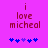 Pixelated text 'i love micheal' in dark red on bright pink background with blue and purple puzzle-piece icons below.