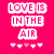 A pink-themed animated icon with text overlays and a person forming a heart shape with their hands.
