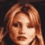 Pixelated close-up of a person with light brown hair against dark background, static single-frame image.