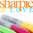 Pixelated image with orange and blue text reading 'SHAMPOO LOVE' above a colorful abstract shape on white background.