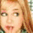 A four- shows a pixelated image of a person with light hair, another in red clothing, a green background with furniture, and a Disney logo on a blue background