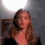 A woman with long brown hair in a black top appears in four showing subtle facial expression changes against a gray background with a bright light source