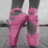 A static image with a light blue background, featuring pink ballet shoes and text phrases in purple pixelated font.