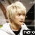 Pixelated image of a person with light blonde hair wearing white and black clothing, showing two where the mouth changes expression