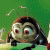 Pixelated cartoon character with large red eyes, dark hair, and antennae against a green background, appearing to float or move forward.