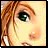 Pixelated close-up of a character's face with brown hair, green eye, and light skin tone against a pale yellow background.
