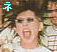 A person with tousled brown hair and glasses appears in six showing different expressions, including shouting and smiling, with colored Japanese characters overlaid