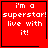 Red square with white pixelated text 'i'm a superstar! live with it!' and black border, featuring small symbols in bottom-right corners of two
